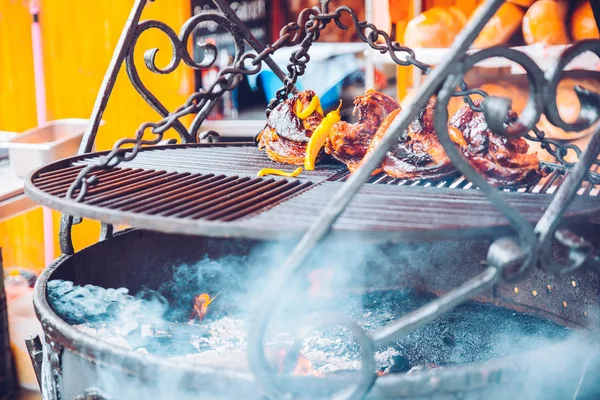 Beef steaks on the grill with flames — Stock Photo, Image