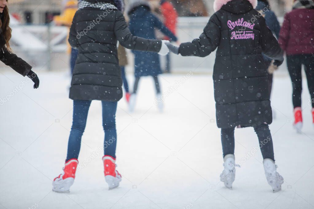 Lviv, Ukraine - January 4, 2019: people at ski rink winter activities