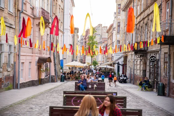 Lviv, Ukraine - September 18, 2018: people walking by tourist city street — Stock Photo, Image