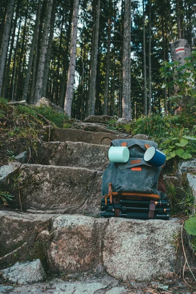 Hiking concept backpack at stone stairs in forest — Φωτογραφία Αρχείου