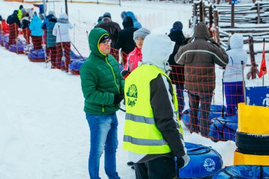 LVIV, UKRAINE - January 7, 2019: line for snow tubing. pull people up to hill.