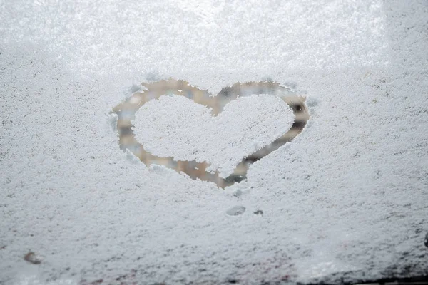 heart love symbol at frozen glass