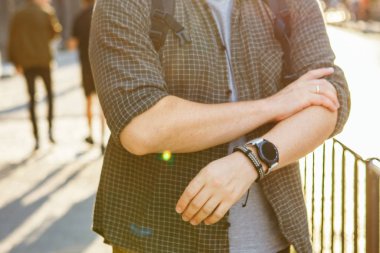 smart watch at men wrist outdoors sunset time