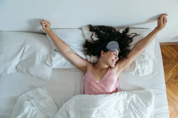 Woman waking at the bright morning. sleeping mask — Stock Photo, Image