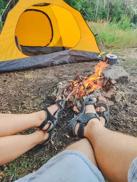 Couple sitting near fire camping concept — 스톡 사진