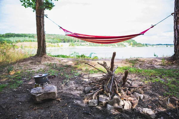 View of camping near lake with hammock between trees — Stock Photo, Image