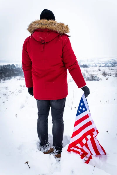 Man Red Winter Coat Holding Usa Flag Outdoors Snowy Weather — Stock Photo, Image