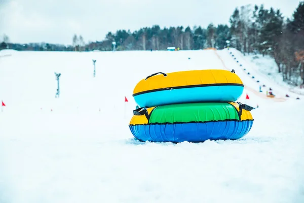 snow tubing rings close up. hill on background. winter family leisure