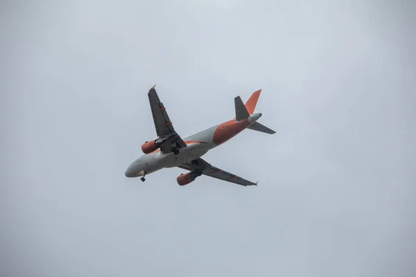 plane in sky landing overcast weather copy space