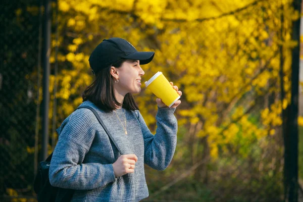Young Stylish Woman Cap Drinking Coffee Outdoors Yellow Paper Cup — Stock Photo, Image
