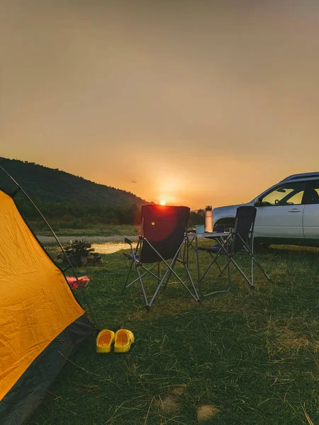 car travel concept camping place near mountains river copy space