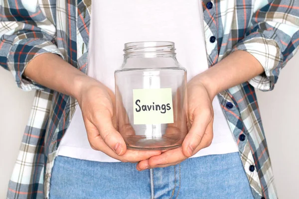 Young woman hold empty glass jar for savings. Bankruptcy concept. — Stock Photo, Image