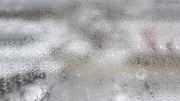 Elevata umidità sotto forma di condensa su un vetro trasparente — Foto Stock