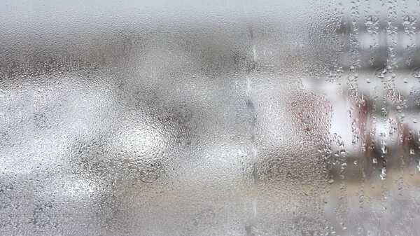 High humidity in the form of condensation on a transparent glass