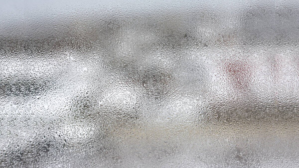 High humidity in the form of condensation on a transparent glass