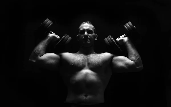 Man makes exercises with barbell. — Stock Photo, Image