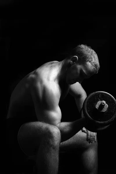 Man makes exercises with barbell. — Stock Photo, Image