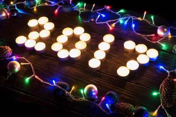 Feliz ano novo 2017 escrito com velas acesas — Fotografia de Stock