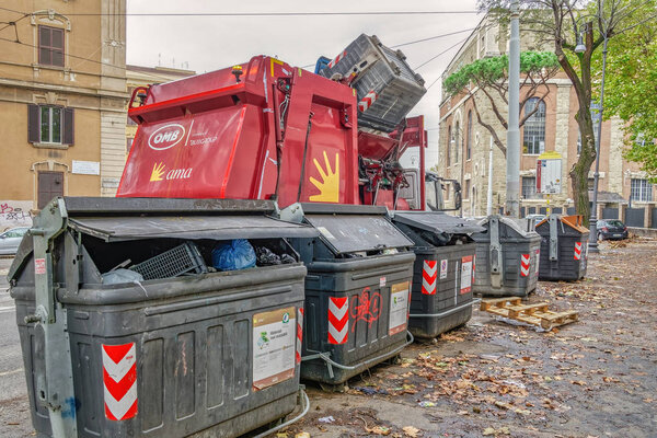 Rome, Italy - November 20 2019: Garbage truck collecting waste disposal.