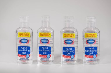 Thessaloniki, Greece - March 04 2020: Alcohol-based hand sanitizer antiseptic gels against white background. Bottles of Safemate liquid, used as a hand disinfectant to kill bacteria.