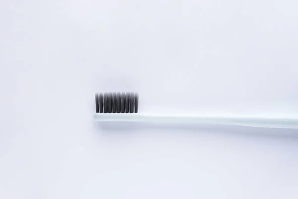 Blue Toothbrush Black Bristles White Background Closeup — Stock Photo, Image