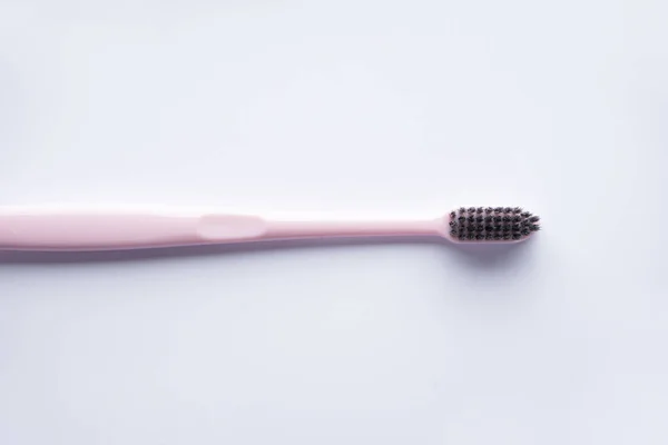 Pink Toothbrush Black Bristles White Background Flat Lay — Stock Photo, Image