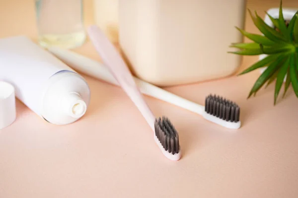 Two Toothbrushes Black Bristles Beige Background Close — Stock Photo, Image