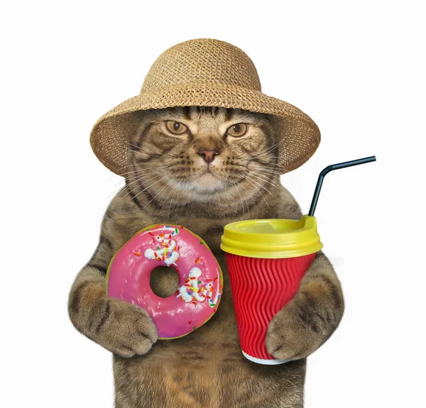 Pembe çörek ve kapuçino ile kedi — Stok fotoğraf