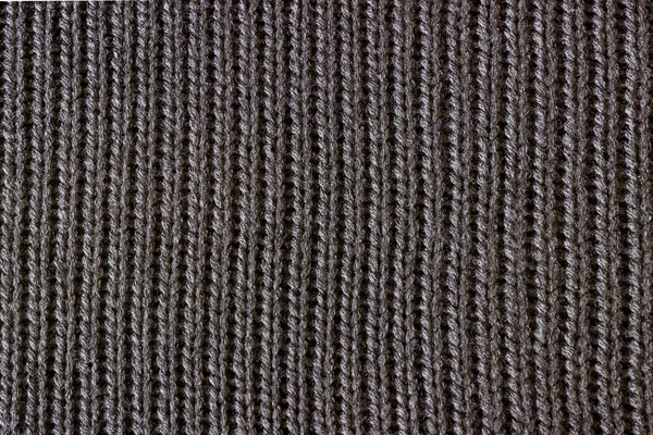 Black knitted fabric. Seamless texture.