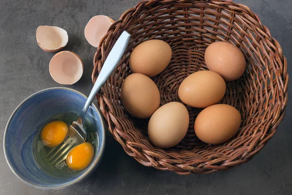 Fresh country eggs . Eggs in a wicker basket .