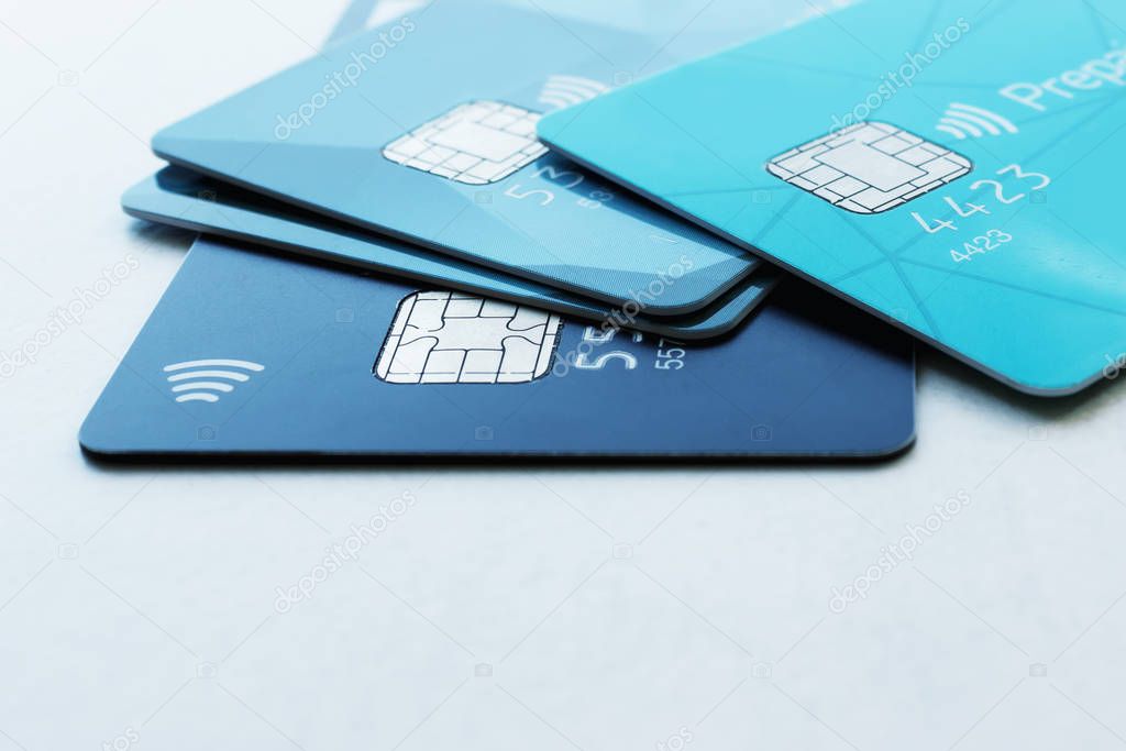 Multiple credit cards on a light background. Selective focus. 