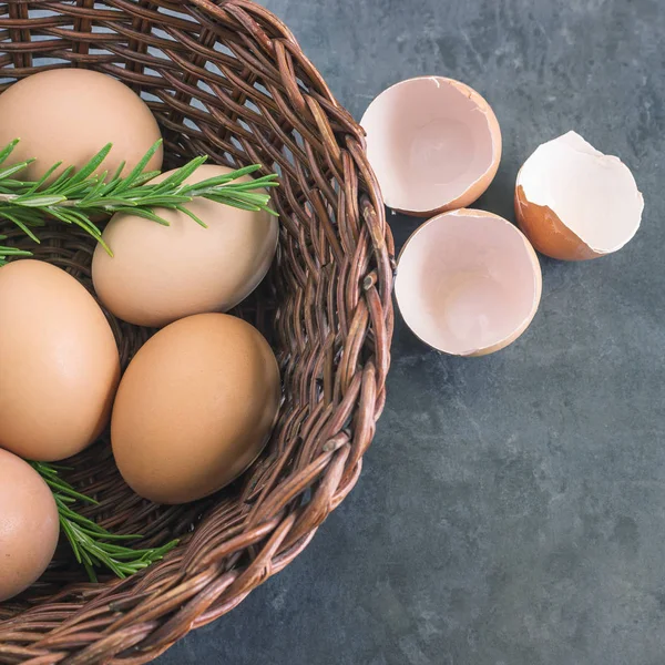 Fresh country eggs . Eggs in a wicker basket .