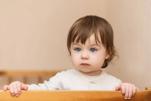 Portrait of adorable baby girl with blue eyes, indoors — Stock Photo, Image