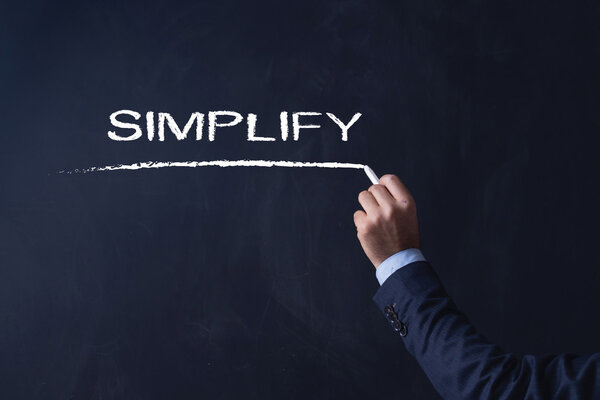 Businessman writing on blackboard