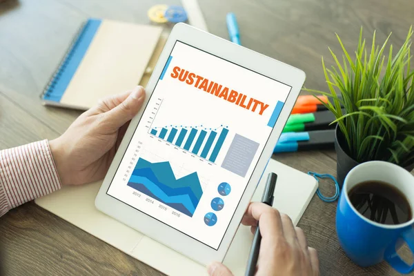 Obchodní grafy a grafy na obrazovce s názvem udržitelnost — Stock fotografie