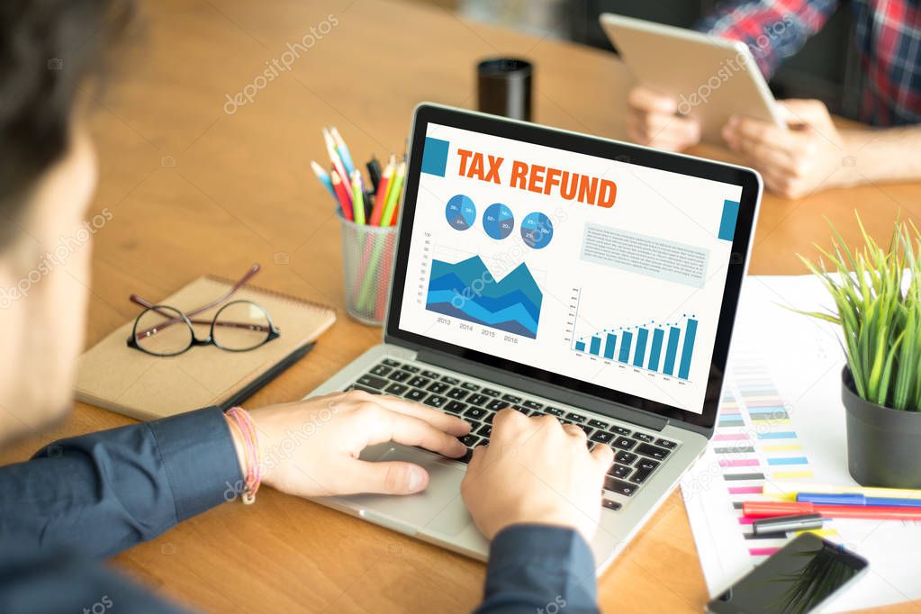 Business Charts and Graphs on screen with TAX REFUND Title