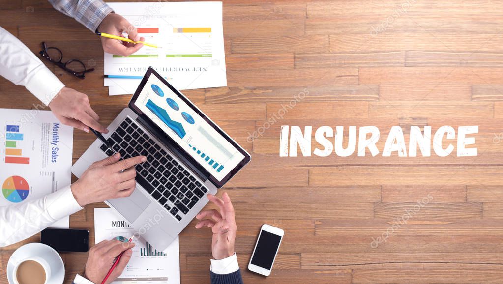 INSURANCE word concept on desk background