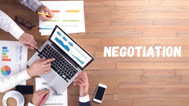 NEGOTIATION word concept on desk background clipart