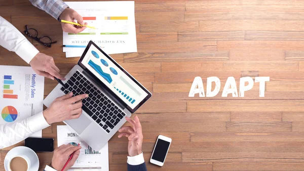 Concept ADAPT, équipe de professionnels au travail — Photo