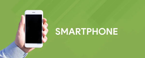 Smartfon w męskiej dłoni — Zdjęcie stockowe