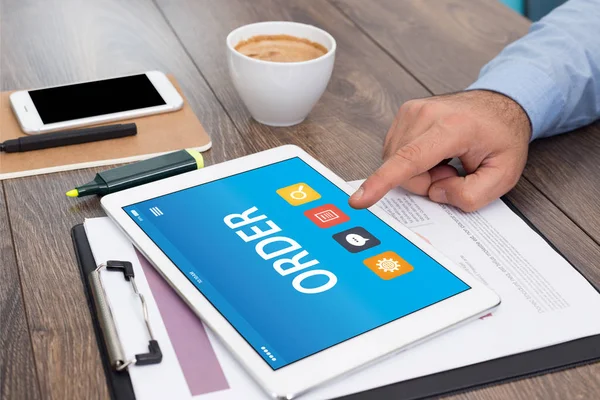 Hands using digital tablet with sign — Stock Photo, Image