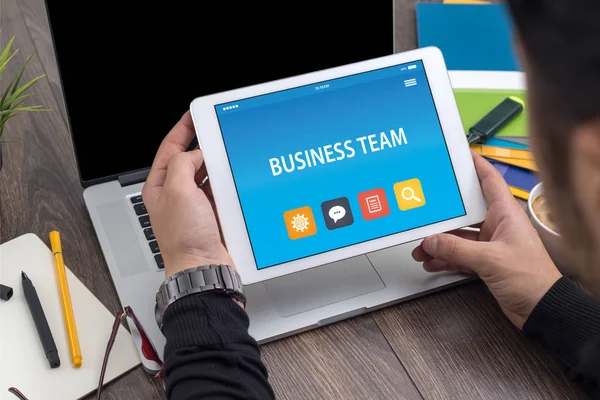 BUSINESS Team ON TABLET PC SCREEN — стоковое фото
