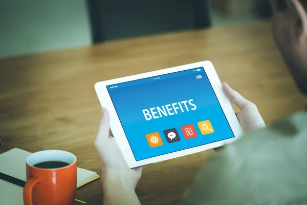 BENEFITS ON TABLE PC SCREEN — стокове фото