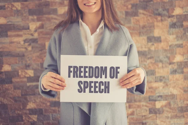Woman presenting FREEDOM OF SPEECH CONCEPT