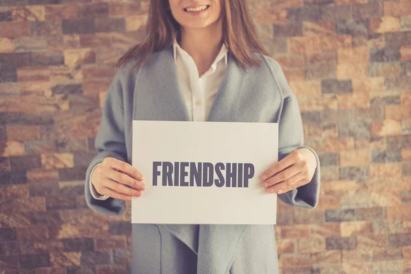 Woman presenting FRIENDSHIP CONCEPT — Stock Photo, Image