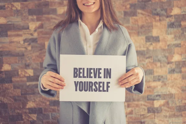 Woman presenting BELIEVE IN YOURSELF CONCEPT — Stock Photo, Image