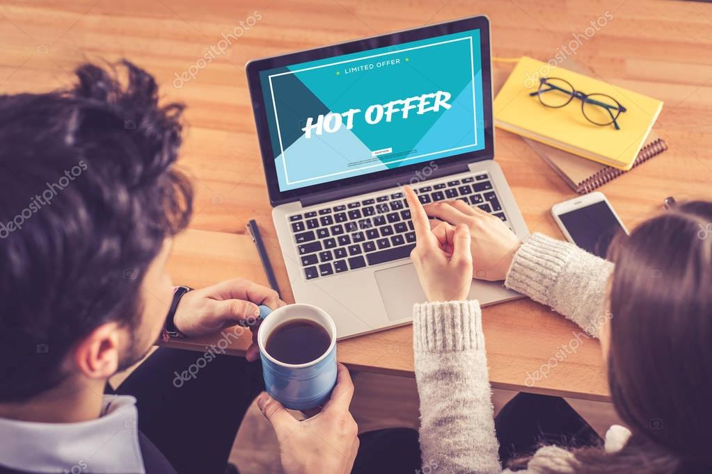 HOT OFFER CONCEPT. People using laptop