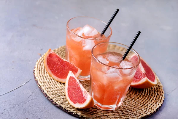 Two Glasses of Tasty Grapefruit Cold Drink or Cocktail Refreshment Beverage Gray Background Cold Grapefruit Juice Copy Space — Stock Photo, Image