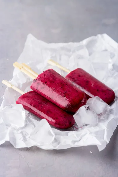 Homemade Berries Ice Pops Tasty and Healthy Ice Cream Gray Background Ice Cube Vertical