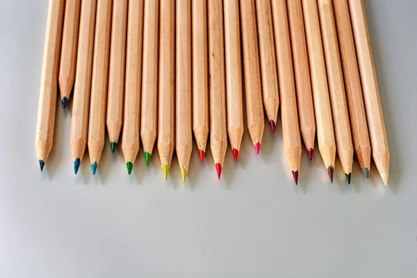 Staggered row of natural wood color pencils